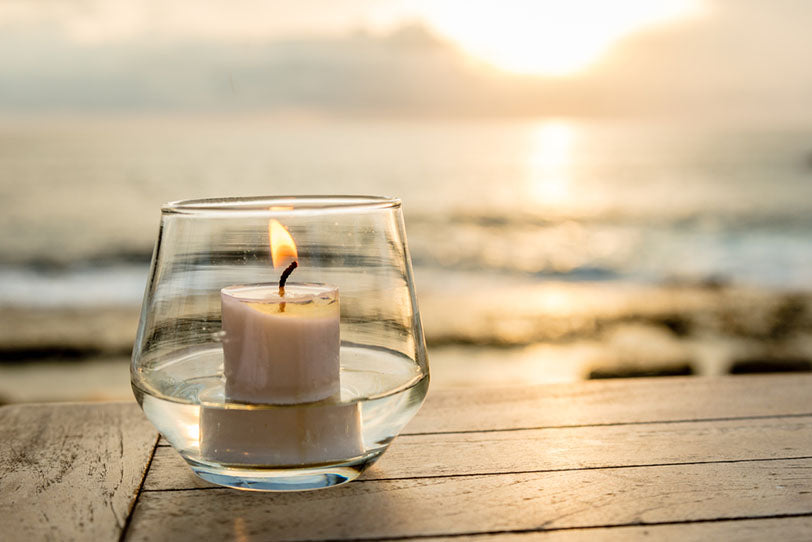 candle on seaside table