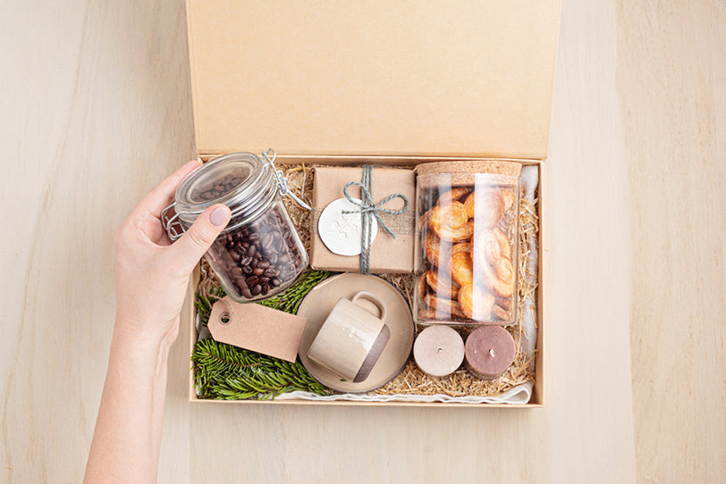 a person preparing a care package
