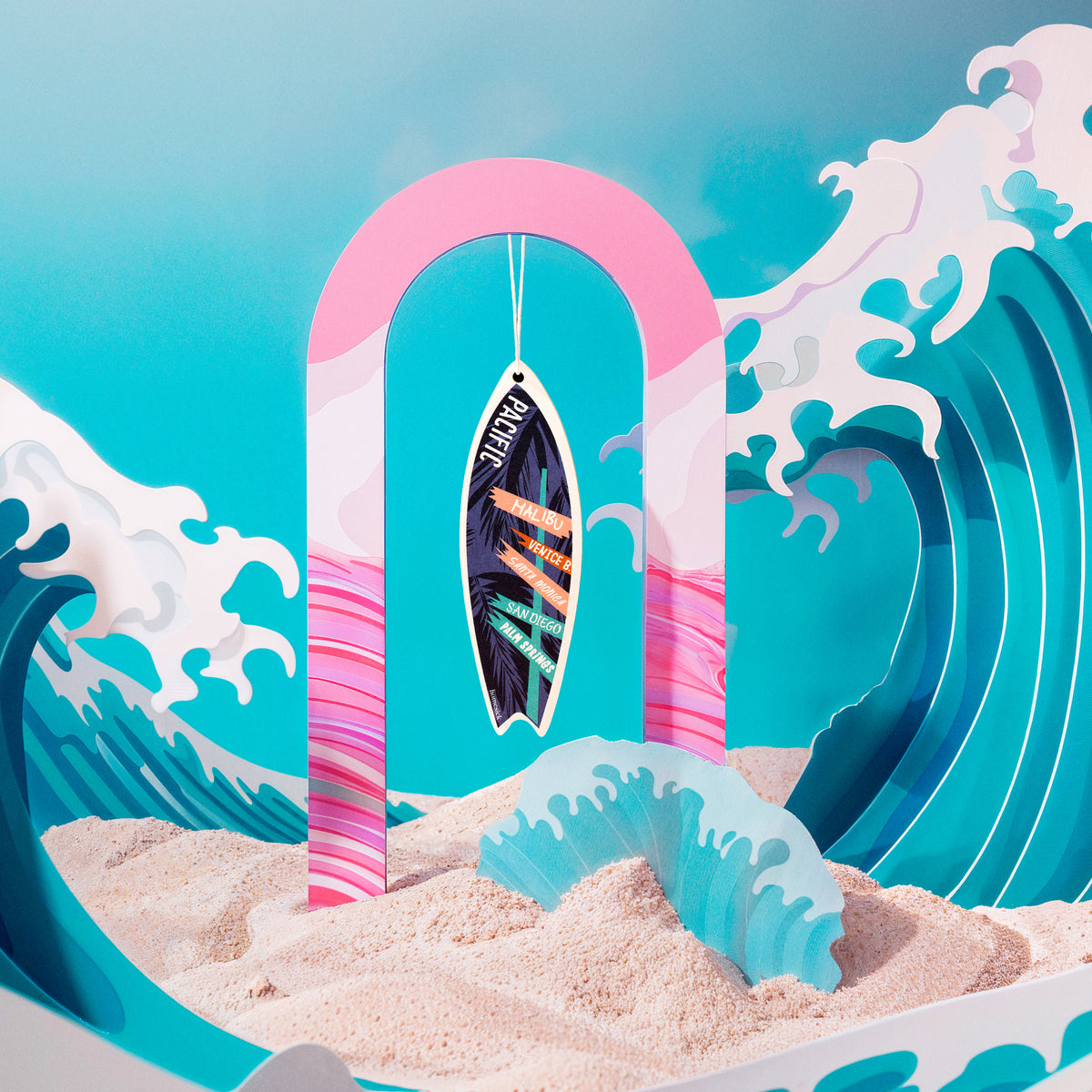 Lifestyle image of a car freshener in a beach scene featuring stylized ocean waves