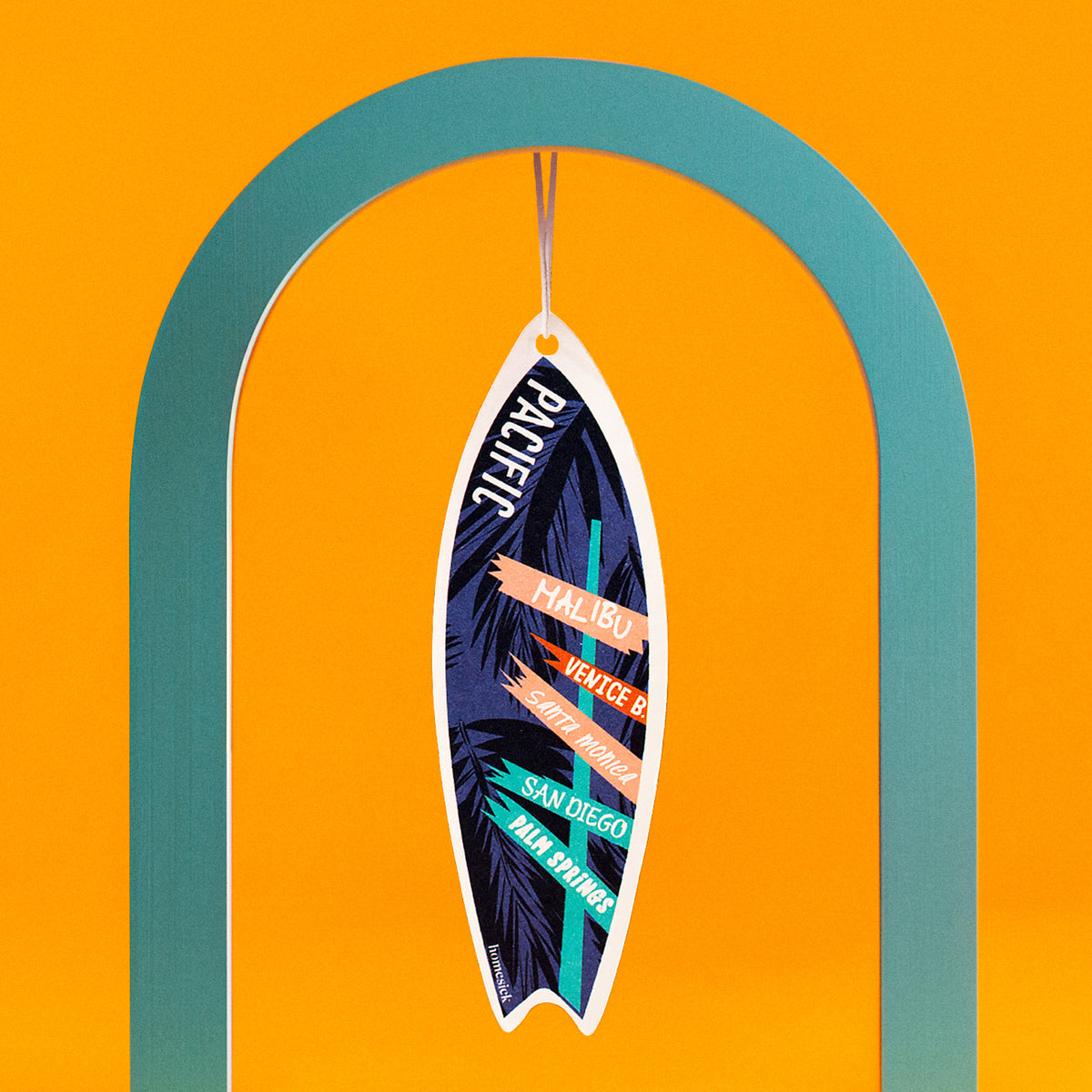 Lifestyle image of a car freshener in an abstract scene