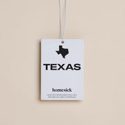 The Texas Car Freshener displayed on a dark cream background.